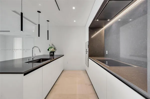 a bathroom with a toilet sink and shower