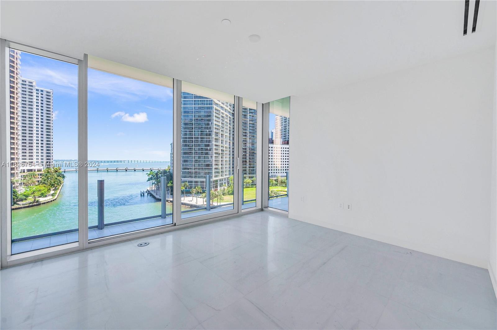 300 Biscayne Blvd Way, Unit 703 Miami, FL 33131 - Photo 16 of 27 an empty room with windows