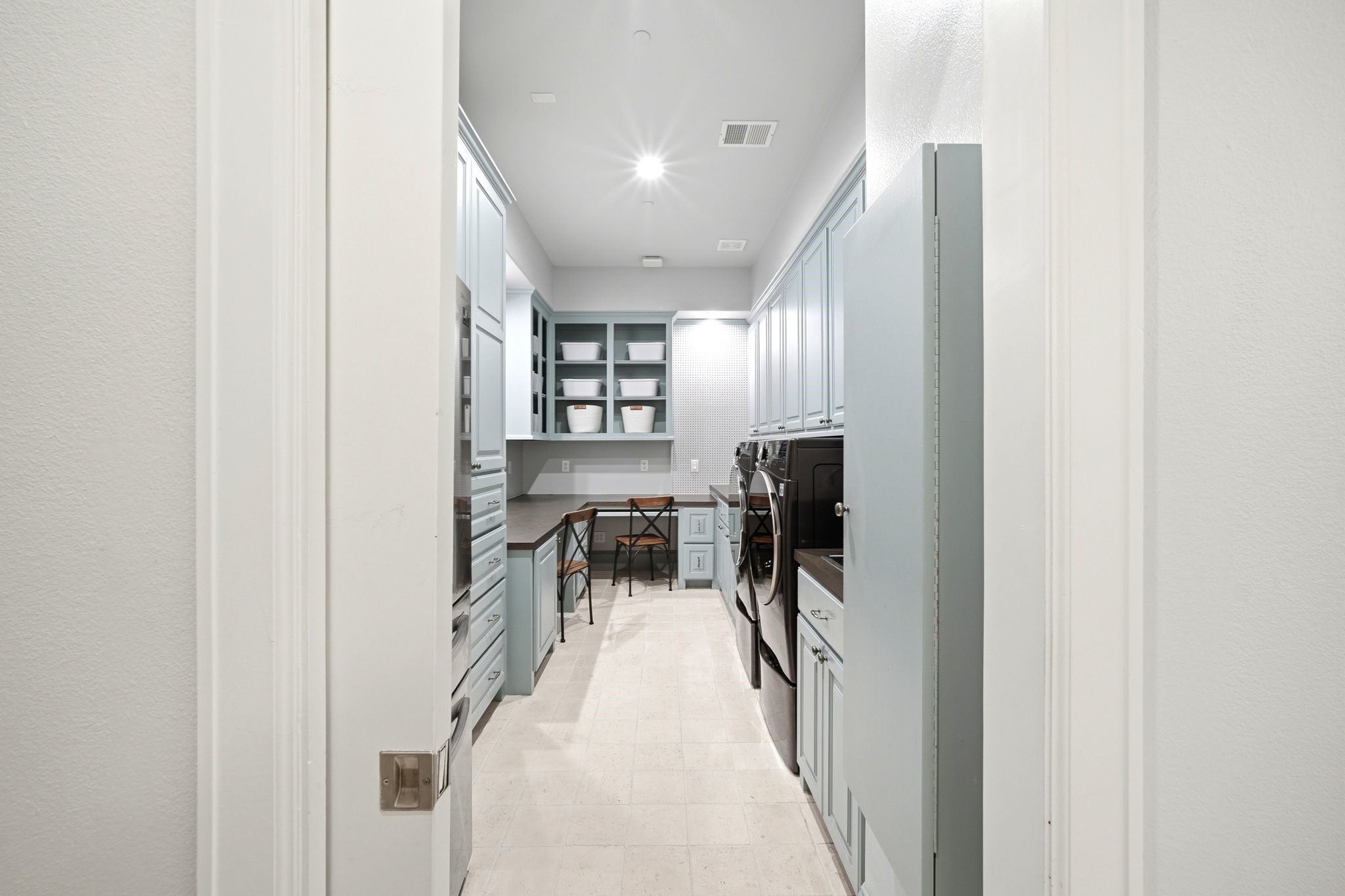 27414 South Rondelet Drive Spring, TX 77386 - Photo 22 of 50 Large utility room with a pocket door and plenty of cabinets and counter space