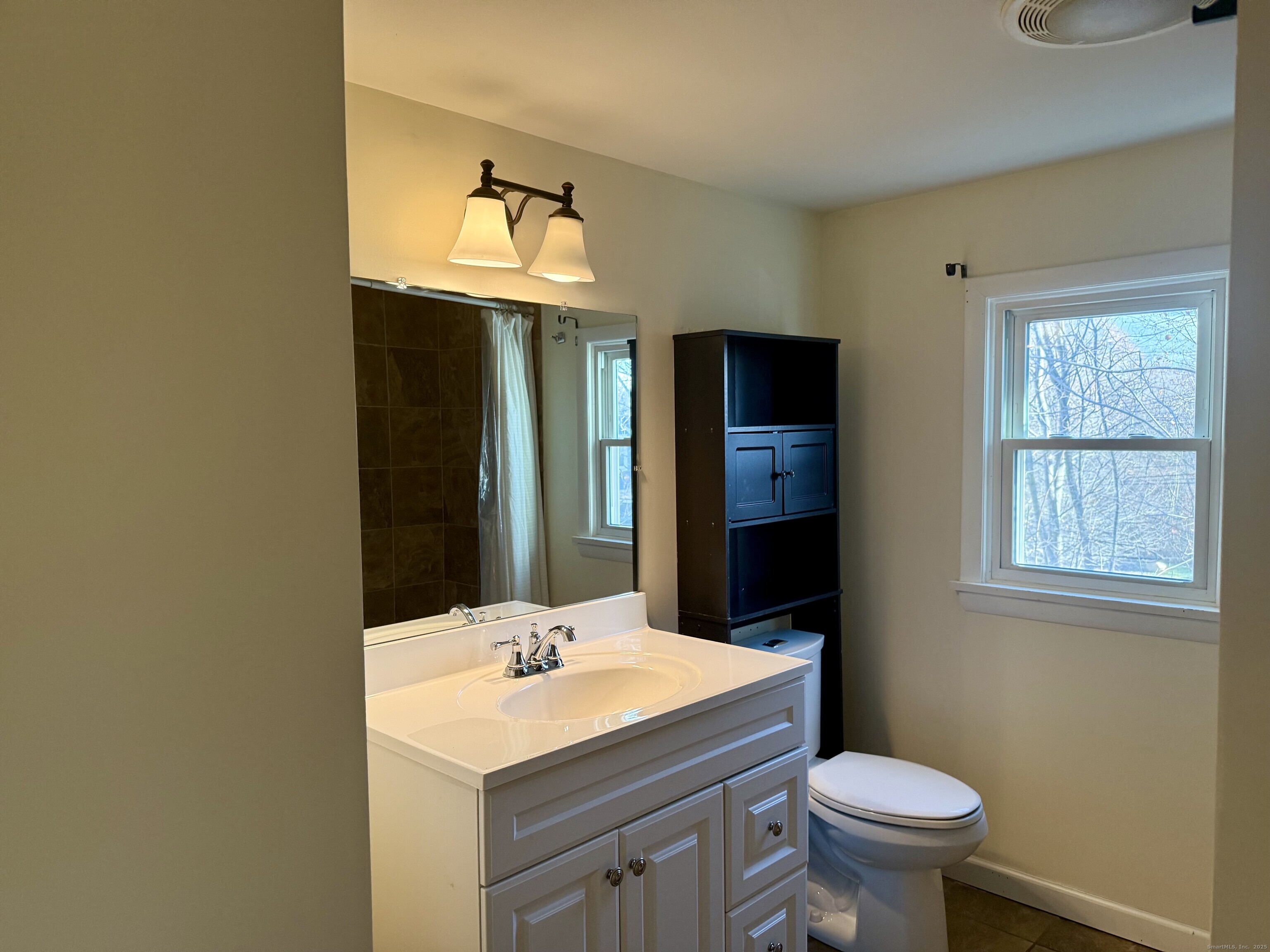 100 Lebanon Avenue Colchester, CT 06415 - Photo 12 of 17 a bathroom with a sink toilet and mirror