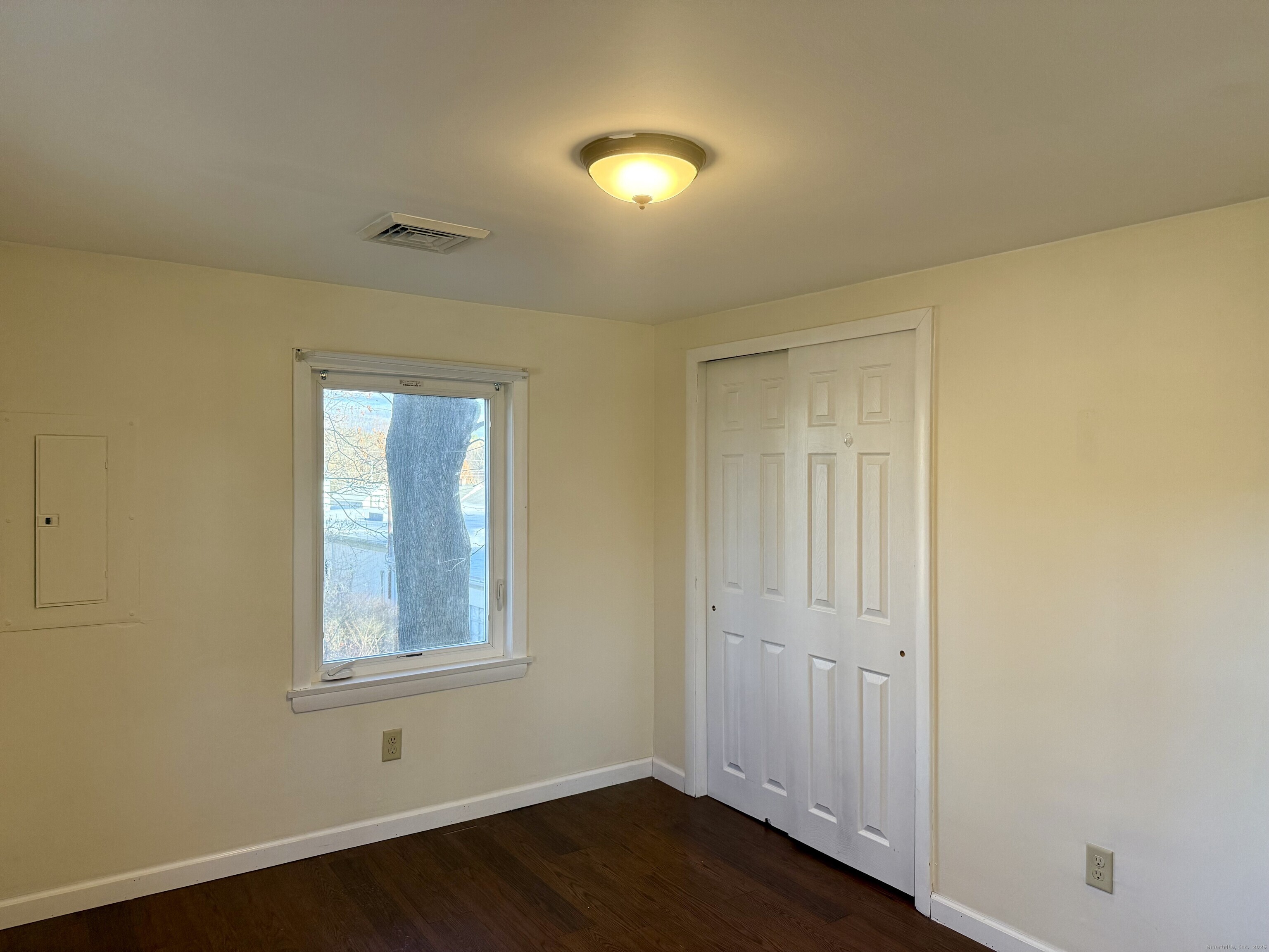 100 Lebanon Avenue Colchester, CT 06415 - Photo 7 of 17 an empty room with wooden floor and windows