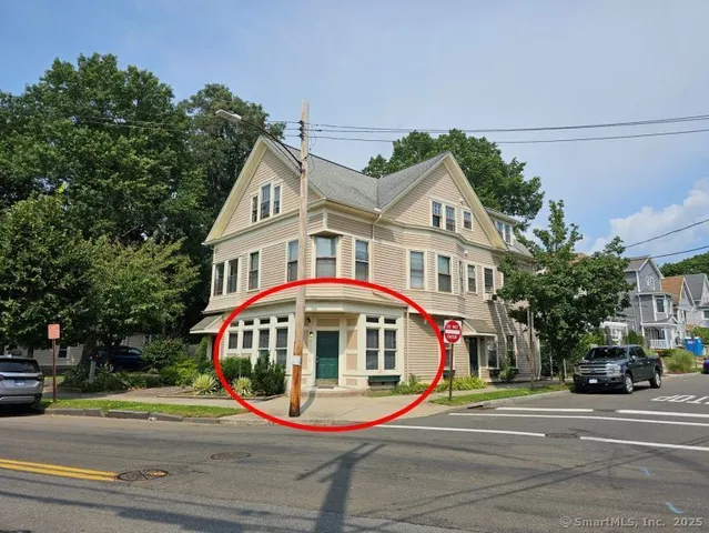 a front view of residential houses with yard