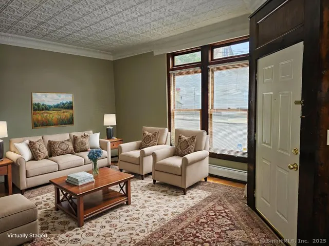 a living room with furniture and a large window