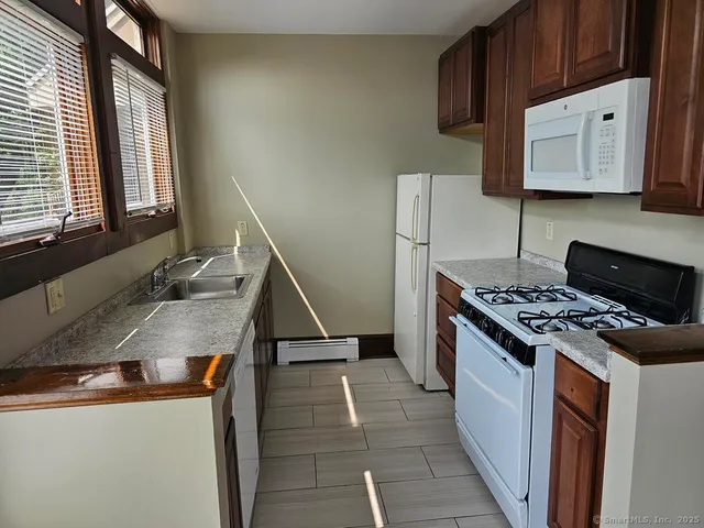 a kitchen with a stove and a sink