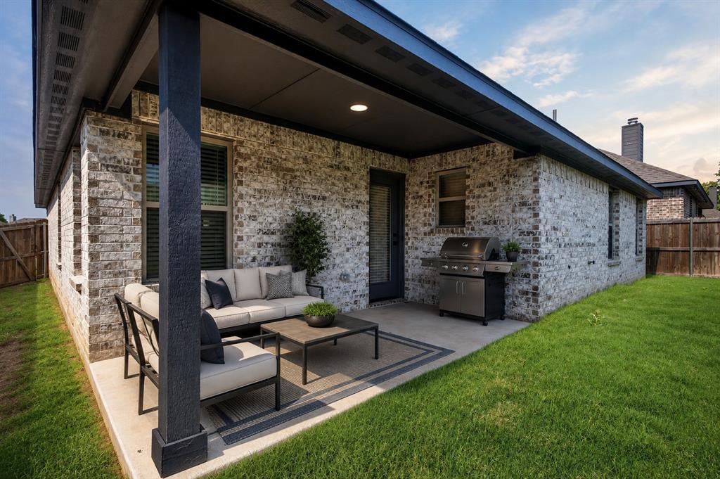 125 Maverick Lane Pilot Point, TX 76258 - Photo 24 of 28 Covered patio featuring a concrete slab and overhead lighting