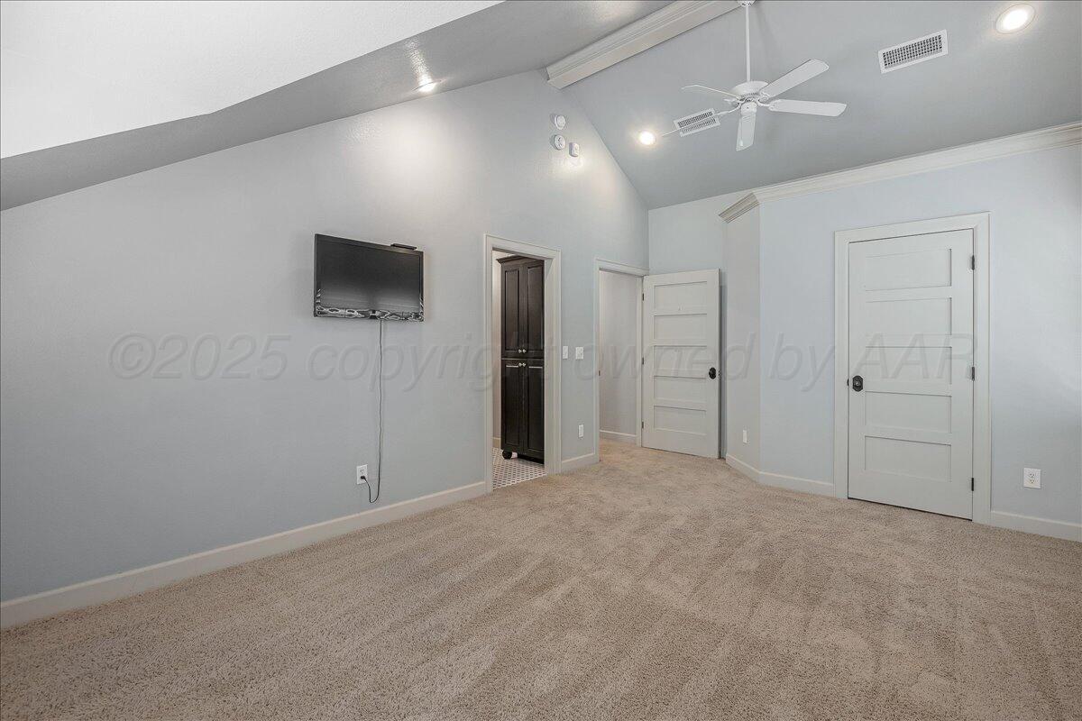 6107 Blue Sage Circle Amarillo, TX 79124 - Photo 61 of 79 en empty room with fan and a flat screen tv