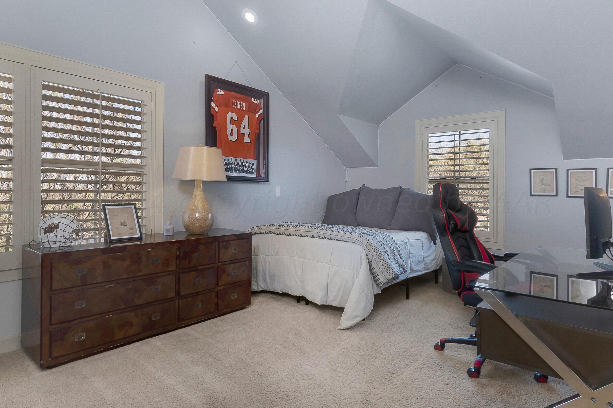 6107 Blue Sage Circle Amarillo, TX 79124 - Photo 63 of 79 a bedroom with a bed and furniture with window