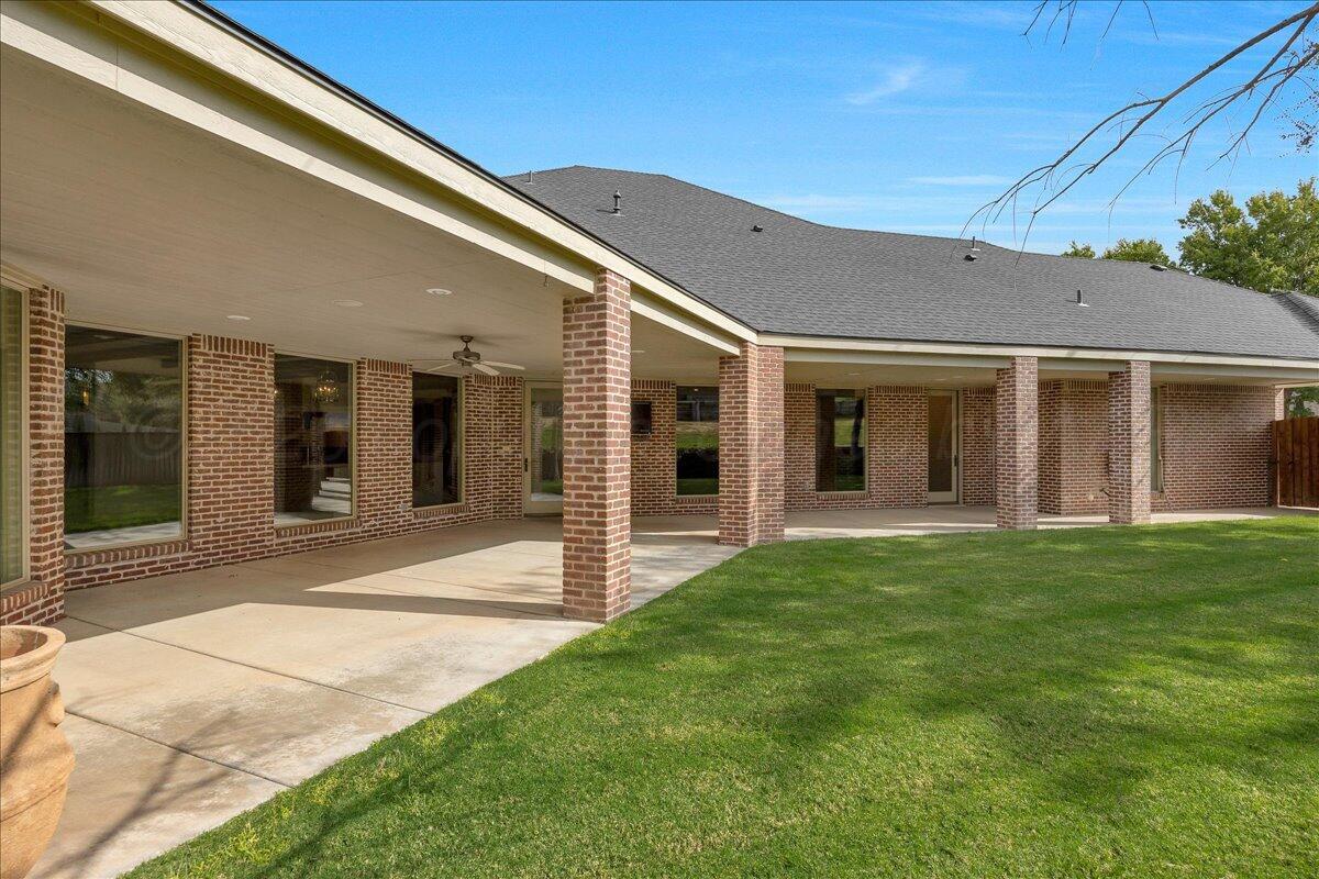 6107 Blue Sage Circle Amarillo, TX 79124 - Photo 71 of 79 a front view of a house with a garden
