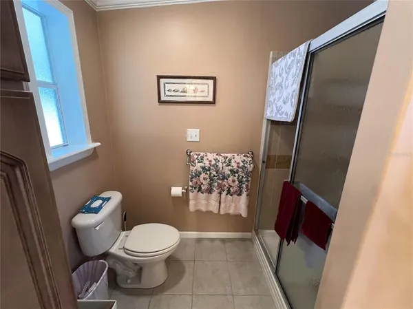 a spacious bathroom with a double vanity sink a mirror and a bathtub