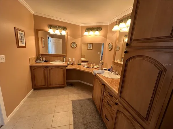 a bedroom with a bed and a large mirror