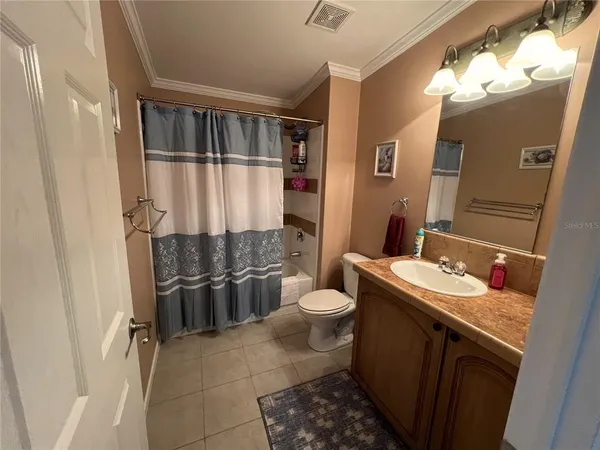 a view of entryway with furniture and wooden floor