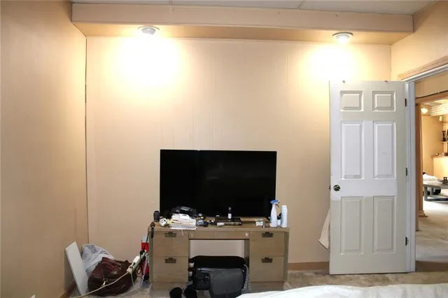 a room with furniture and flat screen tv