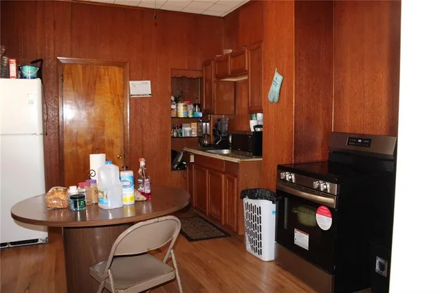 a dining room with furniture and wooden floor