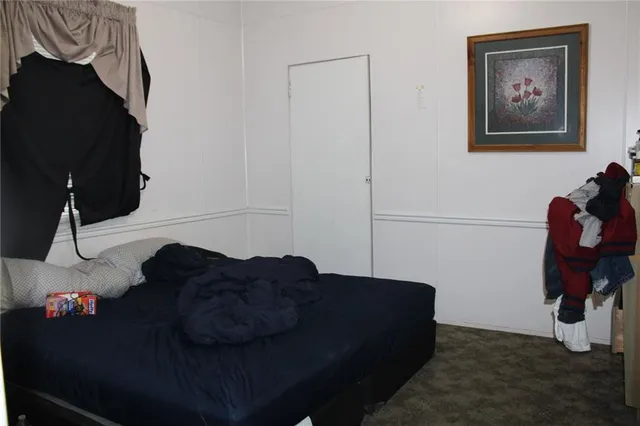 a living room with furniture and a lamp