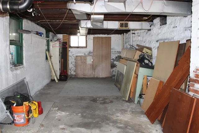a kitchen with a sink cabinets and a window