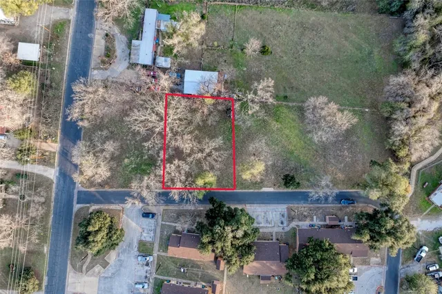 an aerial view of a house with outdoor space