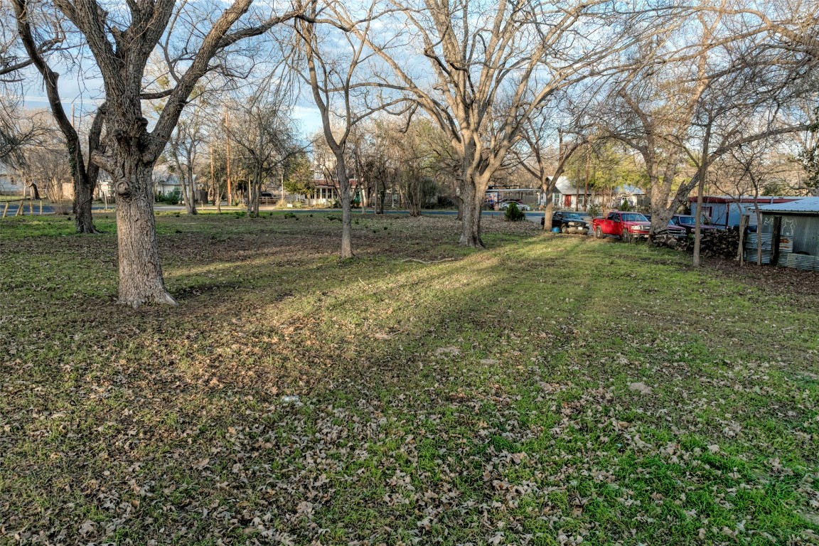 Lot 2 East Alamo Street Elgin, TX 78621 - Photo 3 of 14 a view of road with trees