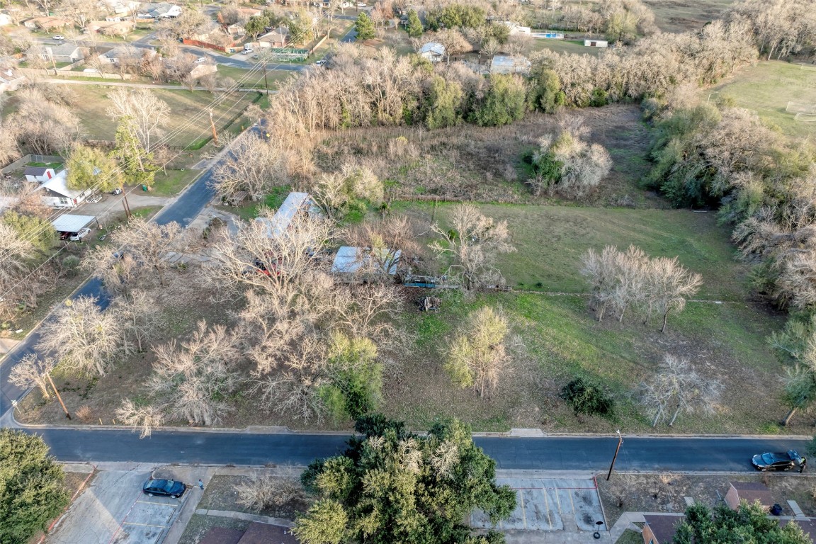 Lot 2 East Alamo Street Elgin, TX 78621 - Photo 7 of 14 a view of a garden with wooden bench