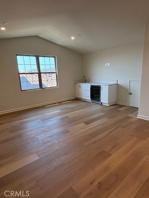 109 Escala Irvine, CA 92618 - Photo 3 of 12 an empty room with wooden floor and windows