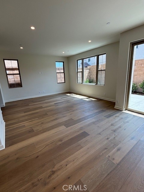 109 Escala Irvine, CA 92618 - Photo 5 of 12 a view of an empty room with wooden floor and a window