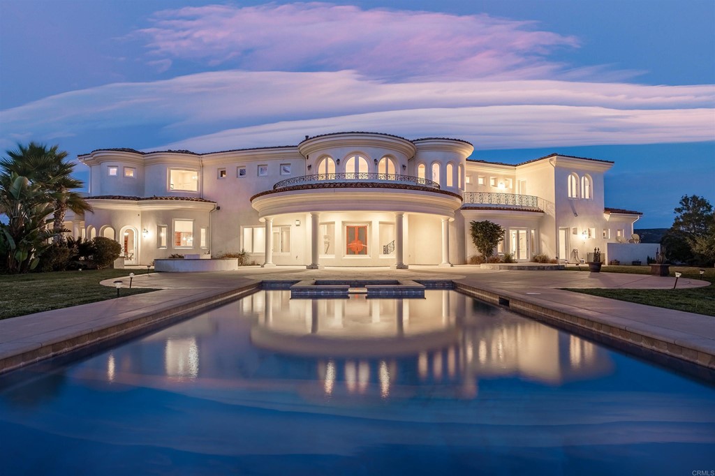 a view of a swimming pool with seating area