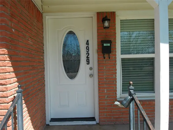 a view of a door of the house with a door
