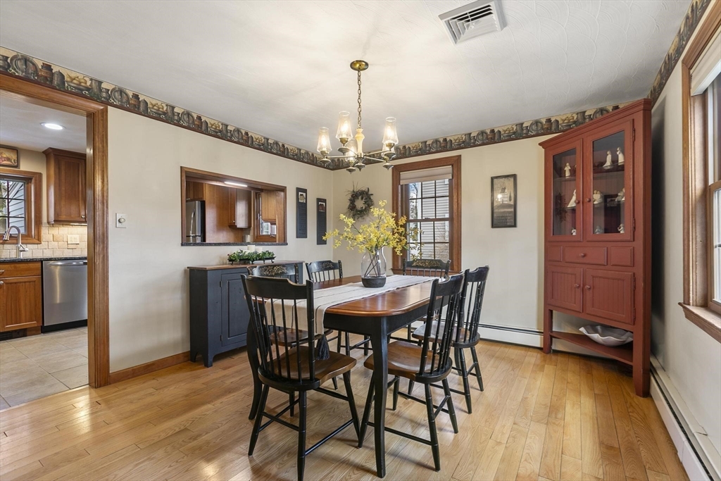 19 Dustin Road Reading, MA 01867 - Photo 17 of 33 a view of a dining room with furniture window and wooden floor