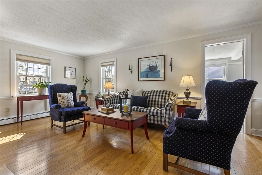 19 Dustin Road Reading, MA 01867 - Photo 10 of 33 a living room with furniture and a wooden floor