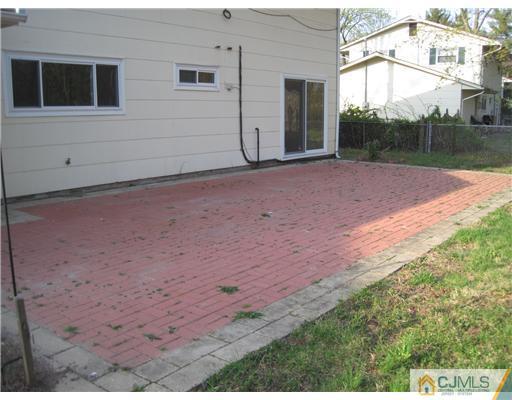 30 Raleigh Road Kendall Park, NJ 08824 - Photo 22 of 25 a view of a backyard