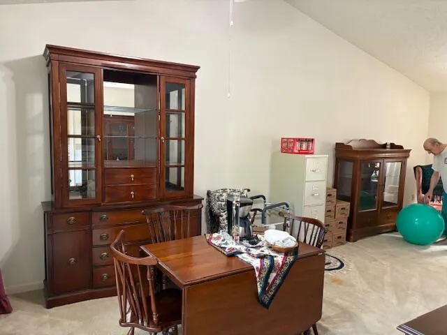 a dining room with furniture and wooden floor