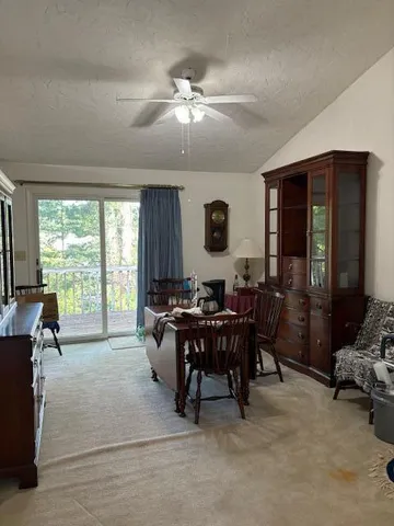 a view of a dining room with furniture window and outside view