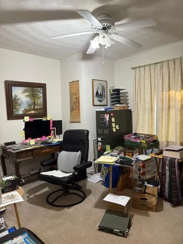 a work room with furniture and a window