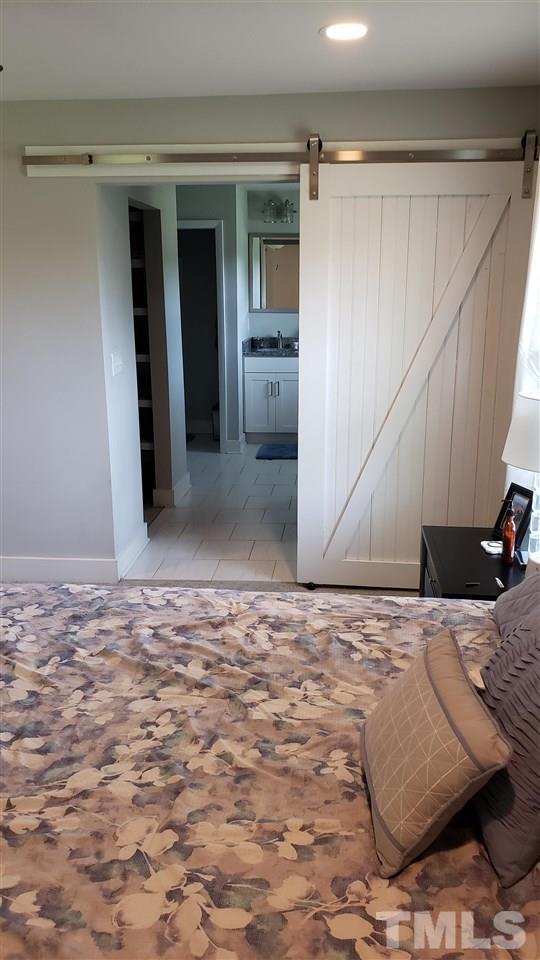 15644 Buffalo Road Wendell, NC 27591 - Photo 21 of 30 Master Bedroom into Bath WICs