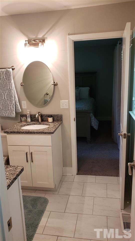 15644 Buffalo Road Wendell, NC 27591 - Photo 28 of 30 Jack Jill Full Bathroom between Bedroom #2 and #3