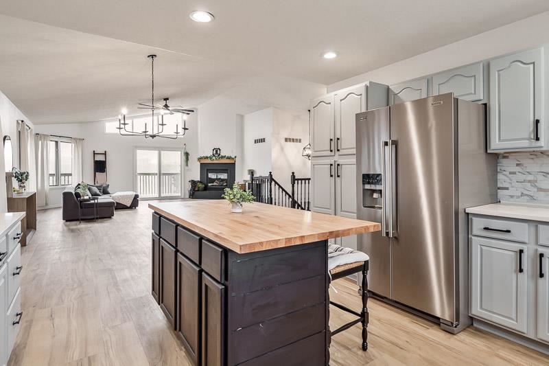 186 Lake Summerset Road Davis, IL 61019 - Photo 11 of 58 a kitchen with stainless steel appliances a table chairs refrigerator and stove