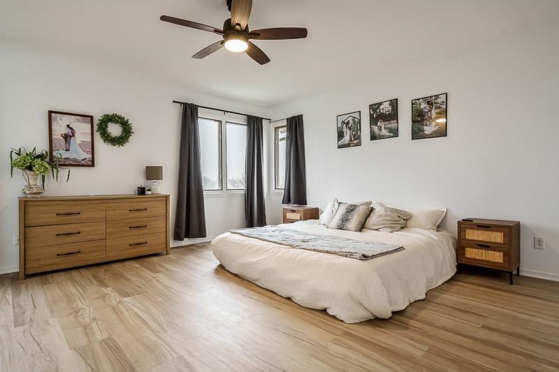 186 Lake Summerset Road Davis, IL 61019 - Photo 13 of 58 a bedroom with a bed and a dresser