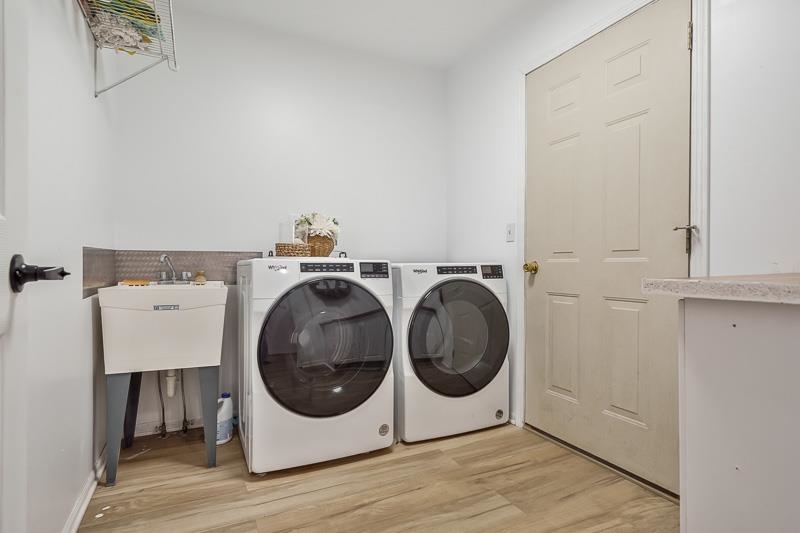 186 Lake Summerset Road Davis, IL 61019 - Photo 22 of 58 a utility room with dryer and washer
