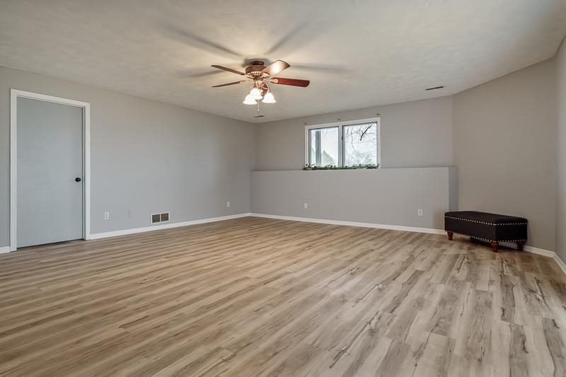 186 Lake Summerset Road Davis, IL 61019 - Photo 27 of 58 a view of empty room with wooden floor and fan