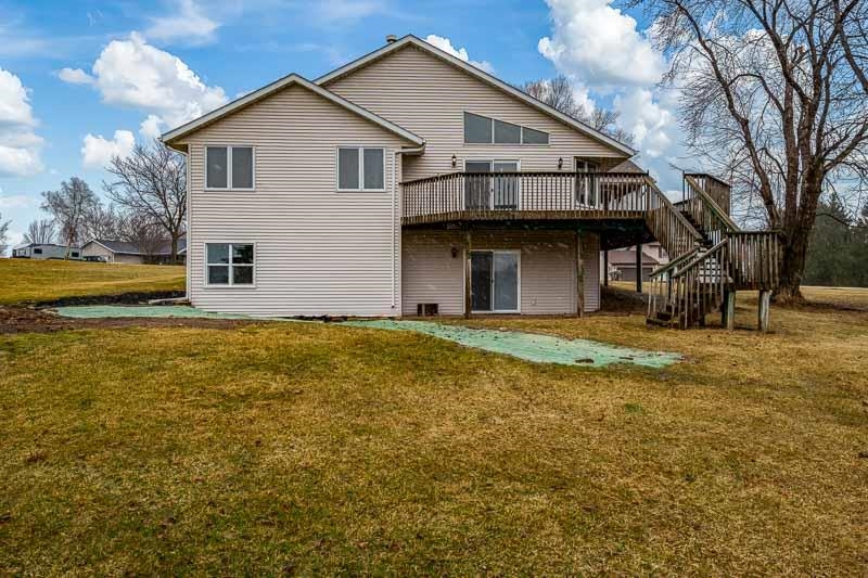 186 Lake Summerset Road Davis, IL 61019 - Photo 38 of 58 a front view of house with yard and trees in the background