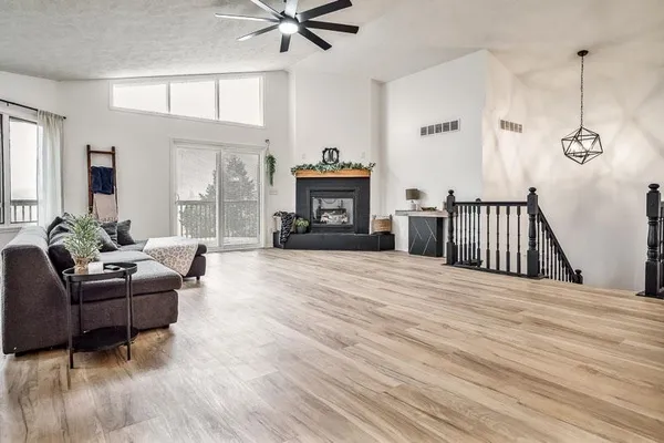 a living room with furniture and a fireplace