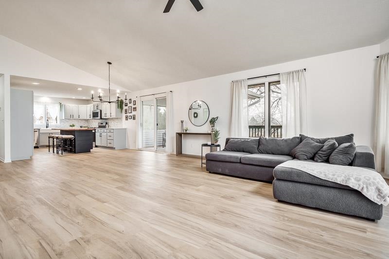 186 Lake Summerset Road Davis, IL 61019 - Photo 6 of 58 a living room with furniture and a chandelier