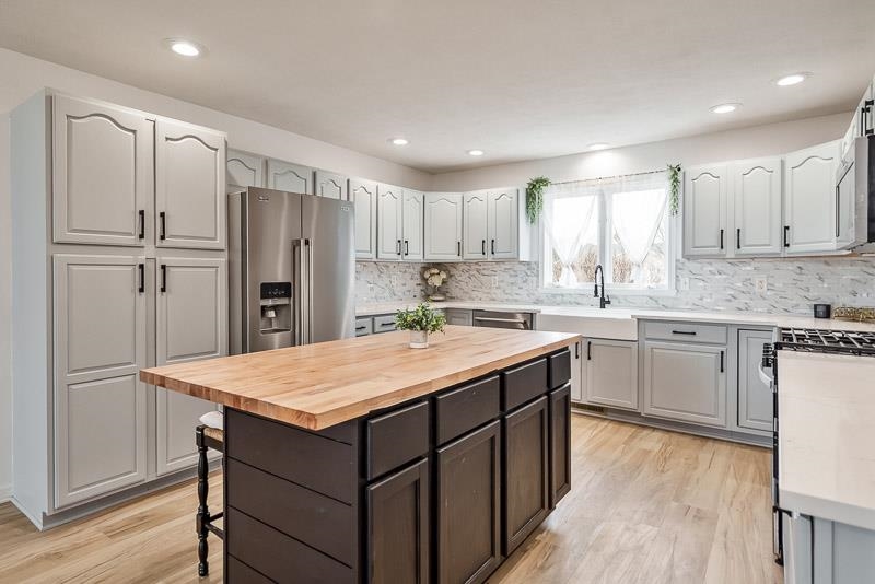 186 Lake Summerset Road Davis, IL 61019 - Photo 9 of 58 a kitchen with a refrigerator sink and cabinets