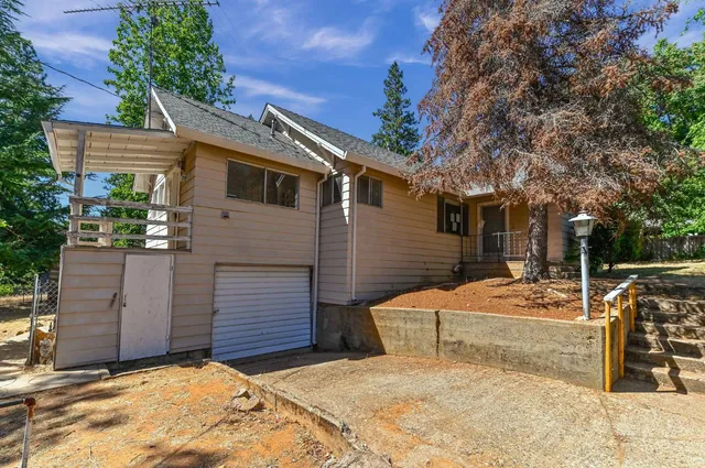 a front view of a house with a garage