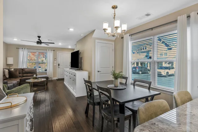 a kitchen with stainless steel appliances a refrigerator sink and microwave
