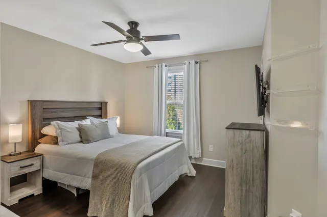 a bedroom with a bed and a couch