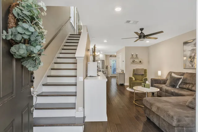 a view of a room with wooden floor and cabinet