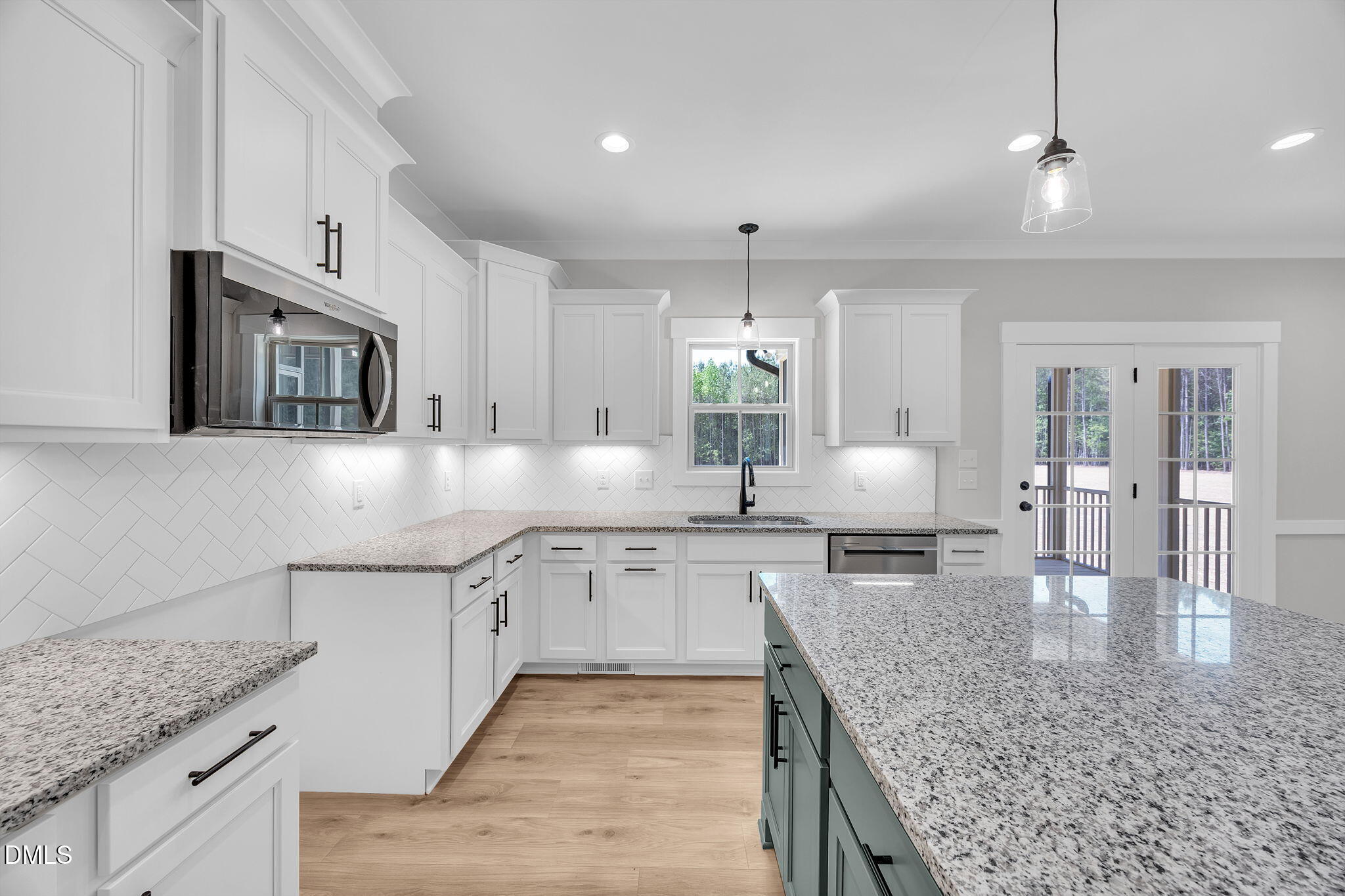378 Freedom Ridge Drive Smithfield, NC 27577 - Photo 11 of 33 a large kitchen with stainless steel appliances granite countertop a sink stove and cabinets