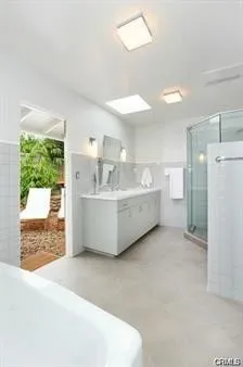 a living room with a sink furniture and a large window