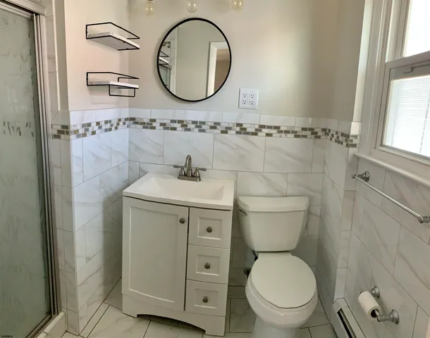 a bathroom with a toilet and a sink
