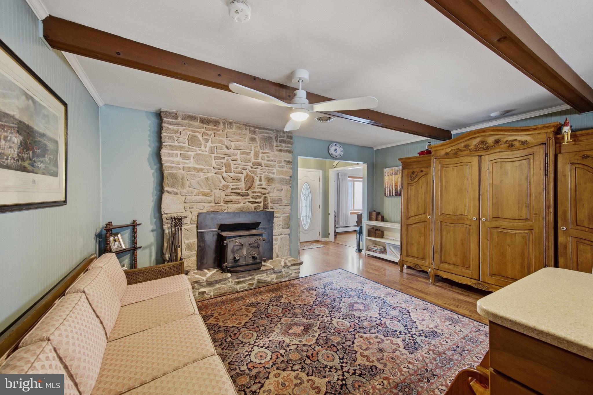 3975 Street Road Street, MD 21154 - Photo 12 of 78 a living room with furniture and a fireplace